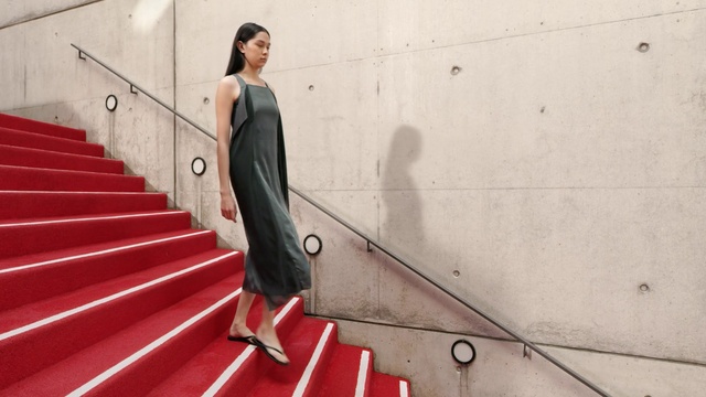 Video Reference: Neck, Flash photography, Sleeve, Standing, Wood, Dress, Flooring, Street fashion, Stairs, Waist