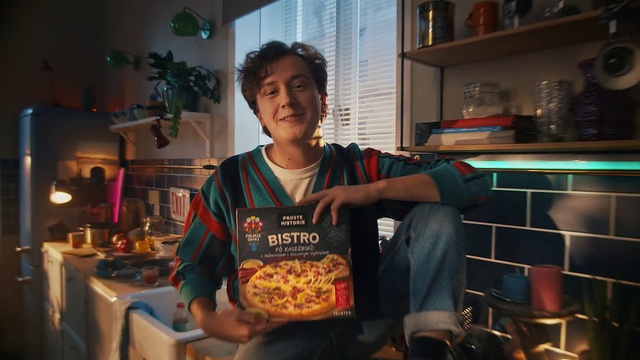 Video Reference: Smile, Food, Plant, Houseplant, T-shirt, Countertop, Cooking, Kitchen, Chair, Cuisine