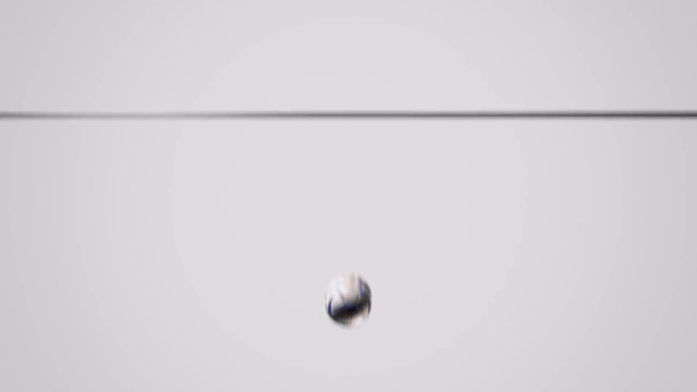 Video Reference: ball, blurred, motion, minimal, plain background, hanging, suspended, indoor, abstract, close-up