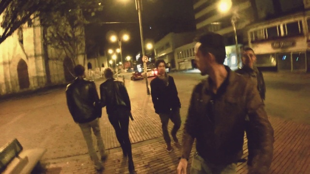 Video Reference: Jeans, Human, Street light, Building, Road surface, Standing, Window, Public space, Jacket, Midnight