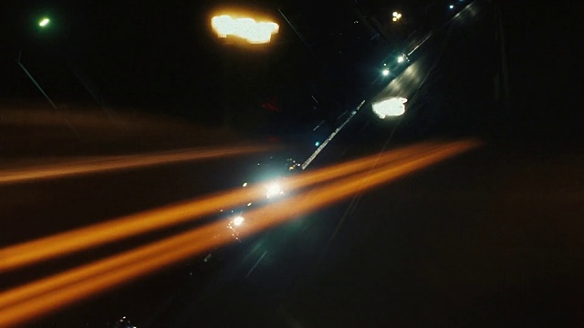 Video Reference: Atmosphere, Automotive lighting, Amber, Headlamp, Electricity, Lens flare, Asphalt, Road, Midnight, Auto part
