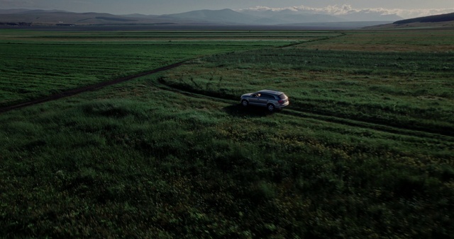 Video Reference: Sky, Vehicle, Plant, Motor vehicle, Car, Land lot, Cloud, Grassland, Natural landscape, Plain
