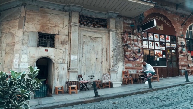 Video Reference: Lighting, Architecture, Chair, Door, Window, Wood, Road surface, Building, Facade, City