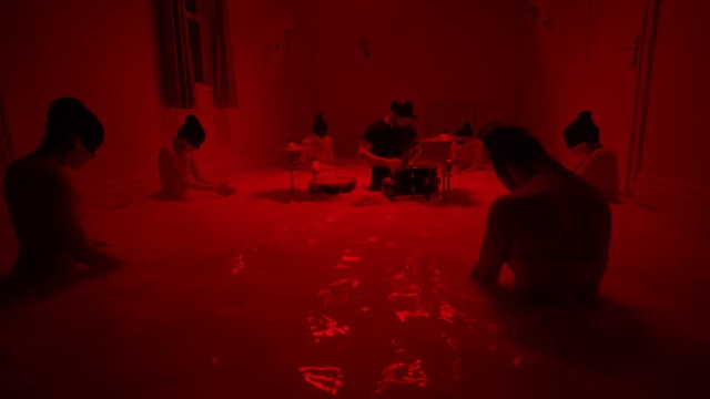 Video Reference: Black, Human, Mammal, Chair, Entertainment, Social group, Flooring, Red, Fun, Performing arts