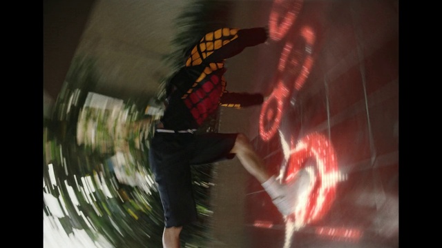 Video Reference: Automotive lighting, Entertainment, Event, Art, Darkness, Circle, Personal protective equipment, Performing arts, Graphics, Fictional character