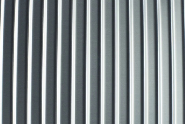 Video Reference: Grille, Grey, Parallel, Automotive tire, Font, Pattern, Symmetry, Automotive exterior, Metal, Electric blue