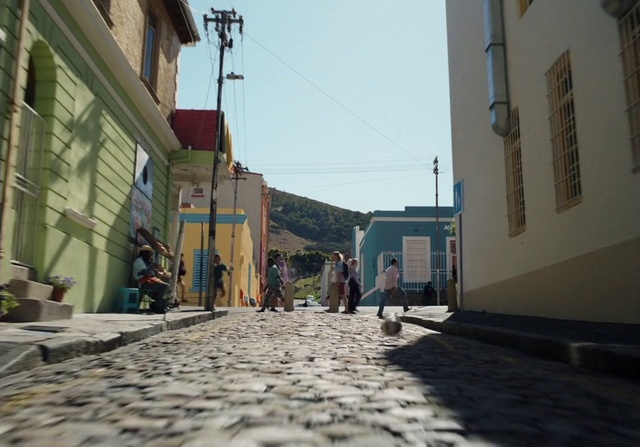 Video Reference: Sky, Window, Road surface, Building, Flooring, Asphalt, Road, Facade, Sidewalk, City