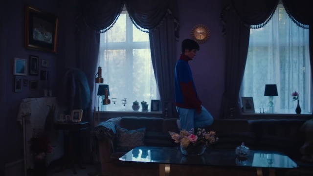 Video Reference: Curtain, Window, Textile, Interior design, Tints and shades, Picture frame, Building, Event, Darkness, Table