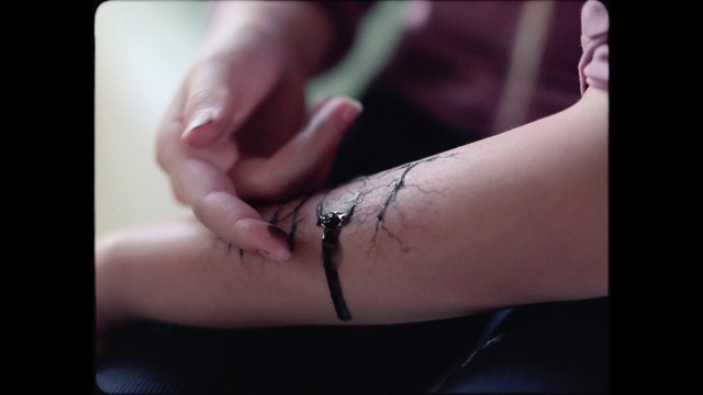 Video Reference: Gesture, Sleeve, Finger, Elbow, Nail, Temporary tattoo, Thumb, Wrist, Font, Knee