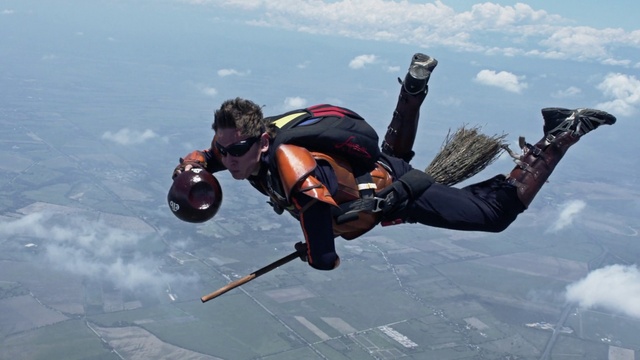 Video Reference: Water, Cloud, Parachuting, Sky, Glove, Windsports, Sports equipment, Leisure, Stunt performer, Dry suit