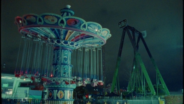 Video Reference: Sky, Font, City, Leisure, Recreation, Amusement ride, Event, Entertainment, Nonbuilding structure, Electric blue