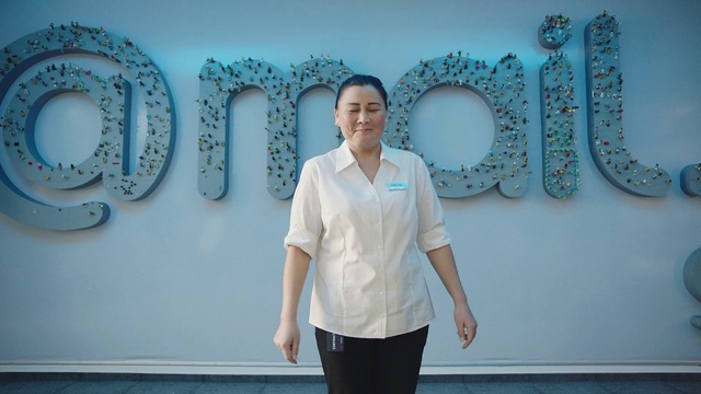 Video Reference: Joint, Smile, Blue, Azure, Sleeve, Standing, Lighting, Dress shirt, Gesture, Wall