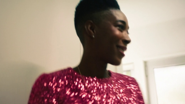 Video Reference: Forehead, Lip, Eyebrow, Shoulder, Smile, Neck, Jaw, Eyelash, Fashion design, Black hair