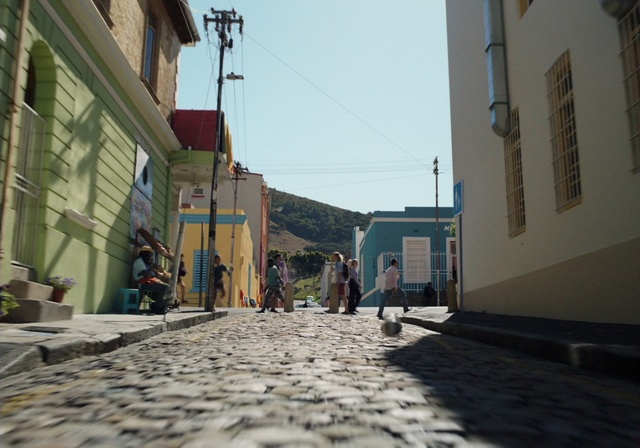 Video Reference: Sky, Window, Road surface, Building, Flooring, Asphalt, Road, Facade, Sidewalk, City