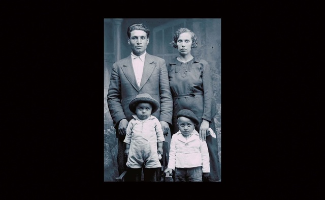 Video Reference: Flash photography, Tie, Sleeve, Coat, Standing, Gesture, Art, Suit, Font, Blazer