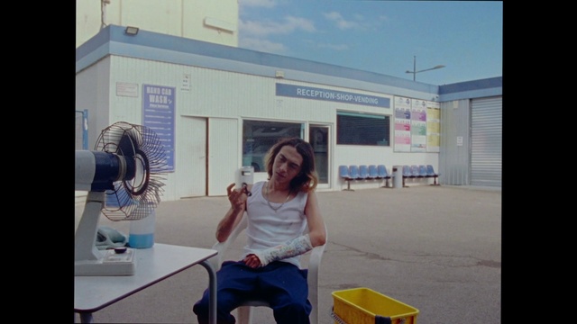 Video Reference: Sky, Building, Table, Event, Leisure, Advertising, Visual arts, Room, Job, Sitting