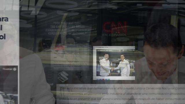 Video Reference: Font, Advertising, News, Display device, Suit, Glass, Display case, Building, Publication, Facade
