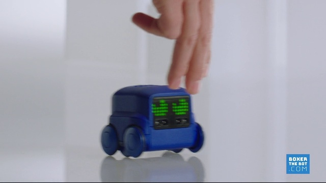Video Reference: Toy, Gesture, Font, Wrist, Gadget, Electric blue, Electronic device, Plastic, Machine, Lego