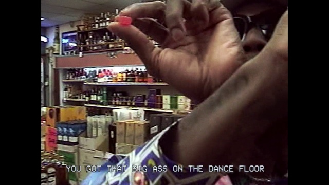 Video Reference: Hand, Gesture, Shelf, Bottle, Finger, Nail, Drink, Alcoholic beverage, Thumb, Alcohol