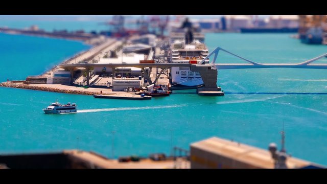 Video Reference: harbor, port, aerial, boat, ferry, cruise ship, pier, water, coastline, marina, travel, transport, sea, tropical, industrial, landscape