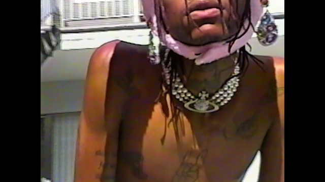 Video Reference: Jaw, Eyewear, Body jewelry, Necklace, Facial hair, Thigh, Chest, Audio equipment, Jewellery, Long hair