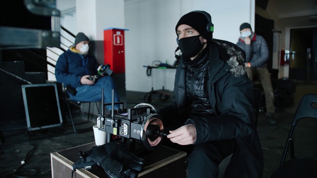 Video Reference: Hat, Jacket, Engineering, Gas, Filmmaking, Workwear, Automotive design, Audio equipment, Cap, Event