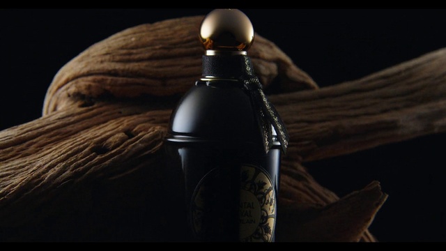 Video Reference: Bottle, Liquid, Drinkware, Glass bottle, Wood, Bottle stopper & saver, Audio equipment, Darkness, Metal, Wine bottle