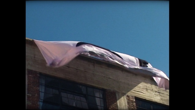 Video Reference: Sky, Flag, Rectangle, Shade, Window, Tints and shades, Facade, Space, Roof, Wing