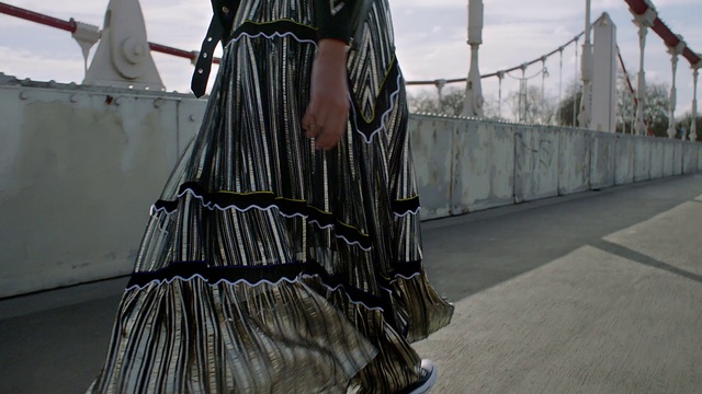 Video Reference: Dress, Sleeve, Bag, Waist, One-piece garment, Street fashion, Day dress, Denim, Luggage and bags, Tartan