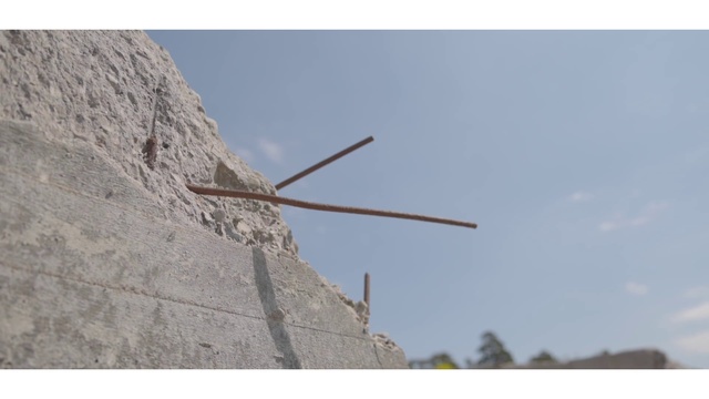 Video Reference: Sky, Wind turbine, Window, Cloud, Line, Building, Slope, Wind, Recreation, Bedrock