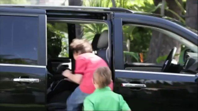Video Reference: van, car, vehicle, open door, people, outdoor, motion blur, parking, transportation, loading, daylight, black vehicle