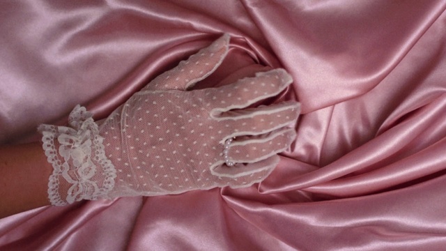 Video Reference: Hand, Outerwear, Shoulder, Purple, Neck, Textile, Sleeve, Gesture, Silk, Pink