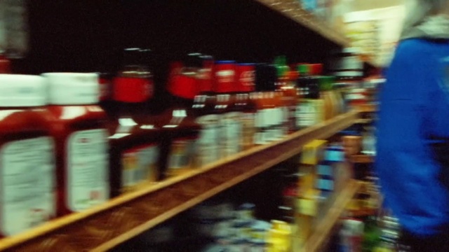Video Reference: Shelf, Publication, Shelving, Alcoholic beverage, Retail, Convenience store, Drink, Tints and shades, Bottle, Building