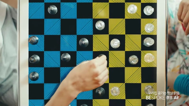 Video Reference: Photograph, Rectangle, Gesture, Yellow, Line, Finger, Font, Material property, Indoor games and sports, Pattern