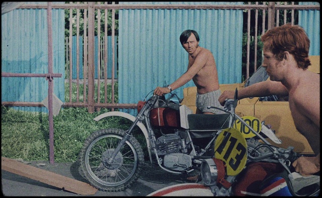 Video Reference: Wheel, Tire, Vehicle, Automotive tire, Motor vehicle, Shorts, Mode of transport, Fence, Automotive lighting, Motorcycle