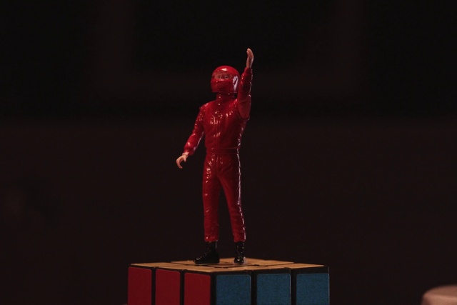 Video Reference: Sculpture, Statue, Art, Entertainment, Monument, Event, Balance, Performing arts, Darkness, Carmine