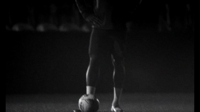 Video Reference: black and white, soccer, football, sports, ball, legs, feet, athlete, dribble, close-up, dark background, low light, studio, action, motion, minimal