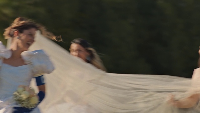 Video Reference: Flash photography, Gesture, Happy, Wood, Bridal accessory, Bridal clothing, Leisure, People in nature, Event, Formal wear