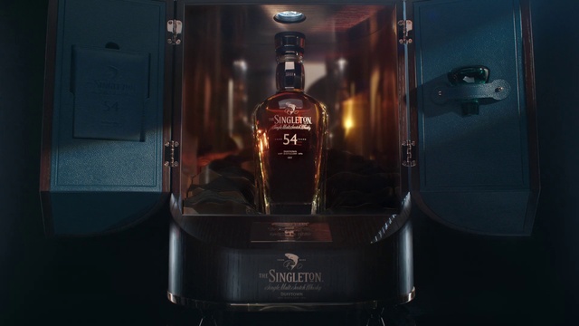 Video Reference: Bottle, Barware, Glass bottle, Alcoholic beverage, Automotive design, Liquid, Drink, Distilled beverage, Whisky, Fictional character