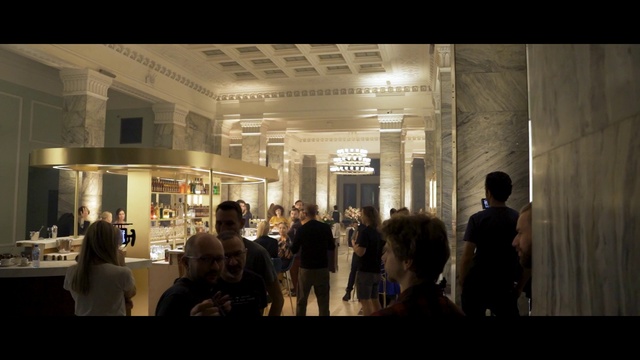 Video Reference: Fixture, Event, T-shirt, City, Visual arts, Art, Crowd, Font, Tourist attraction, Darkness