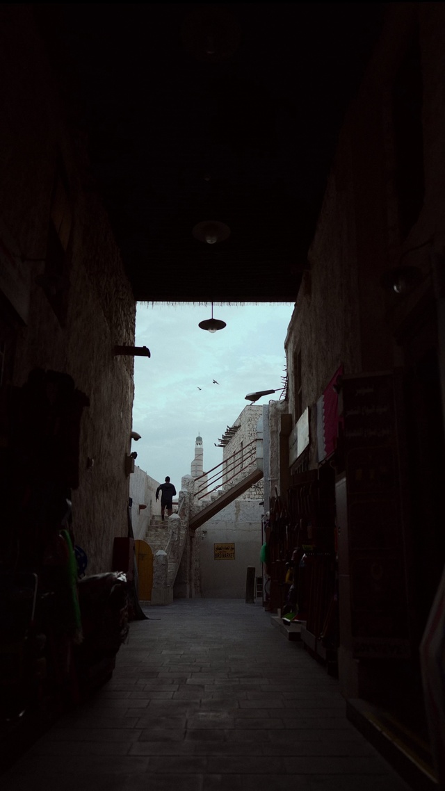 Video Reference: Sky, Building, Road surface, Alley, House, Road, Tints and shades, City, Flooring, Art