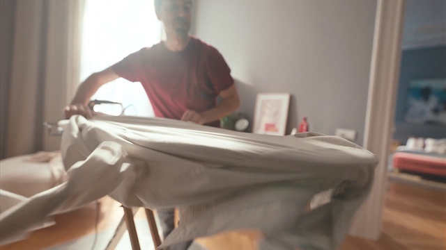 Video Reference: Shoulder, Comfort, Wood, Textile, Elbow, T-shirt, Flooring, Curtain, Hardwood, Room