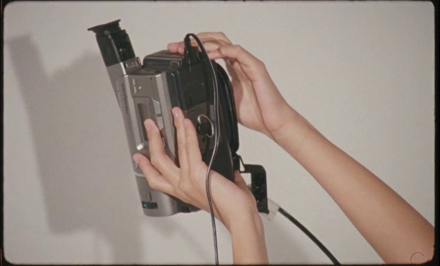 Video Reference: Neck, Sleeve, Gesture, Eyelash, Electrical wiring, Wrist, Gadget, Thumb, Cable, Electrical supply