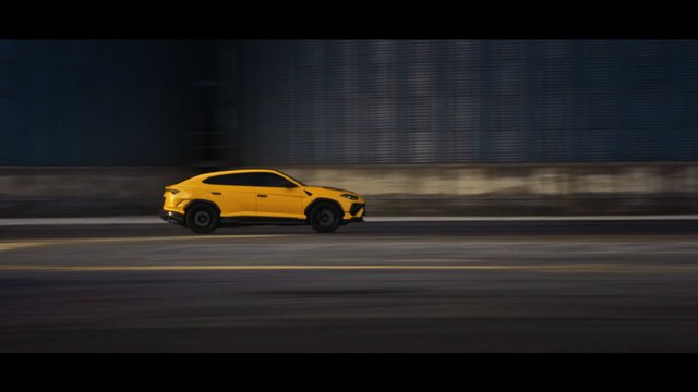 Video Reference: yellow SUV, car, driving, motion blur, road, vehicle, urban, industrial, speed, side view, night, transportation