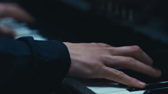 Video Reference: piano, keyboard, hand, music, playing, close-up, low light, instrument, performance, melody, practice, classical, musician, finger, artistic, indoor