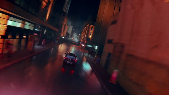 Video Reference: Automotive lighting, Building, Window, Road surface, Mode of transport, Car, Vehicle, Sky, Asphalt, Thoroughfare