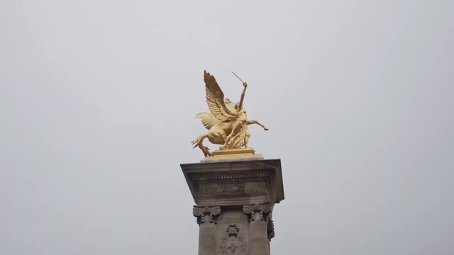 Video Reference: Sky, Statue, Sculpture, Building, Art, Pedestal, Creative arts, Monument, Wing, Metal