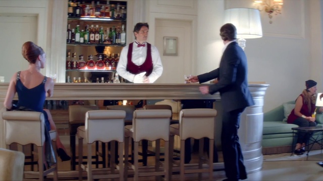 Video Reference: Furniture, Bottle, Table, Barware, Glass bottle, Event, Shelf, Room, Drinkware, T-shirt