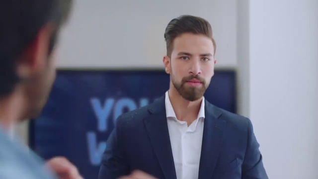 Video Reference: Forehead, Outerwear, Beard, Sleeve, Gesture, Collar, Blazer, White-collar worker, Suit, Eyelash