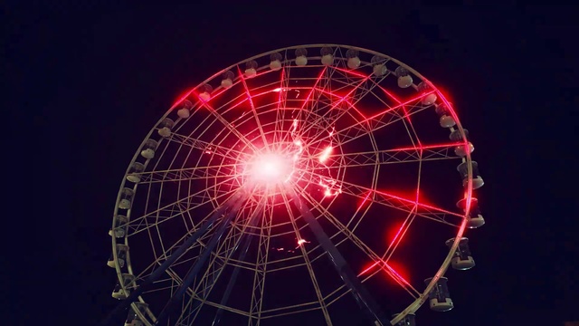 Video Reference: Sky, Ferris wheel, Recreation, Midnight, Electric blue, Event, Circle, Amusement ride, Gas, Science